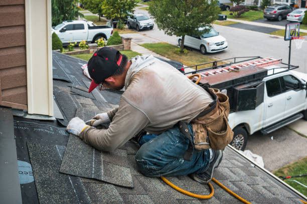 Professional Roof Leak Repair technician working in Harcourt, IA